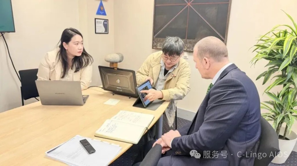NSK representatives demonstrate the C-Lingo AI Chinese learning tablet