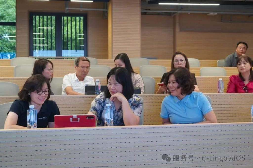Principals try the Chinese learning tablet during the visit